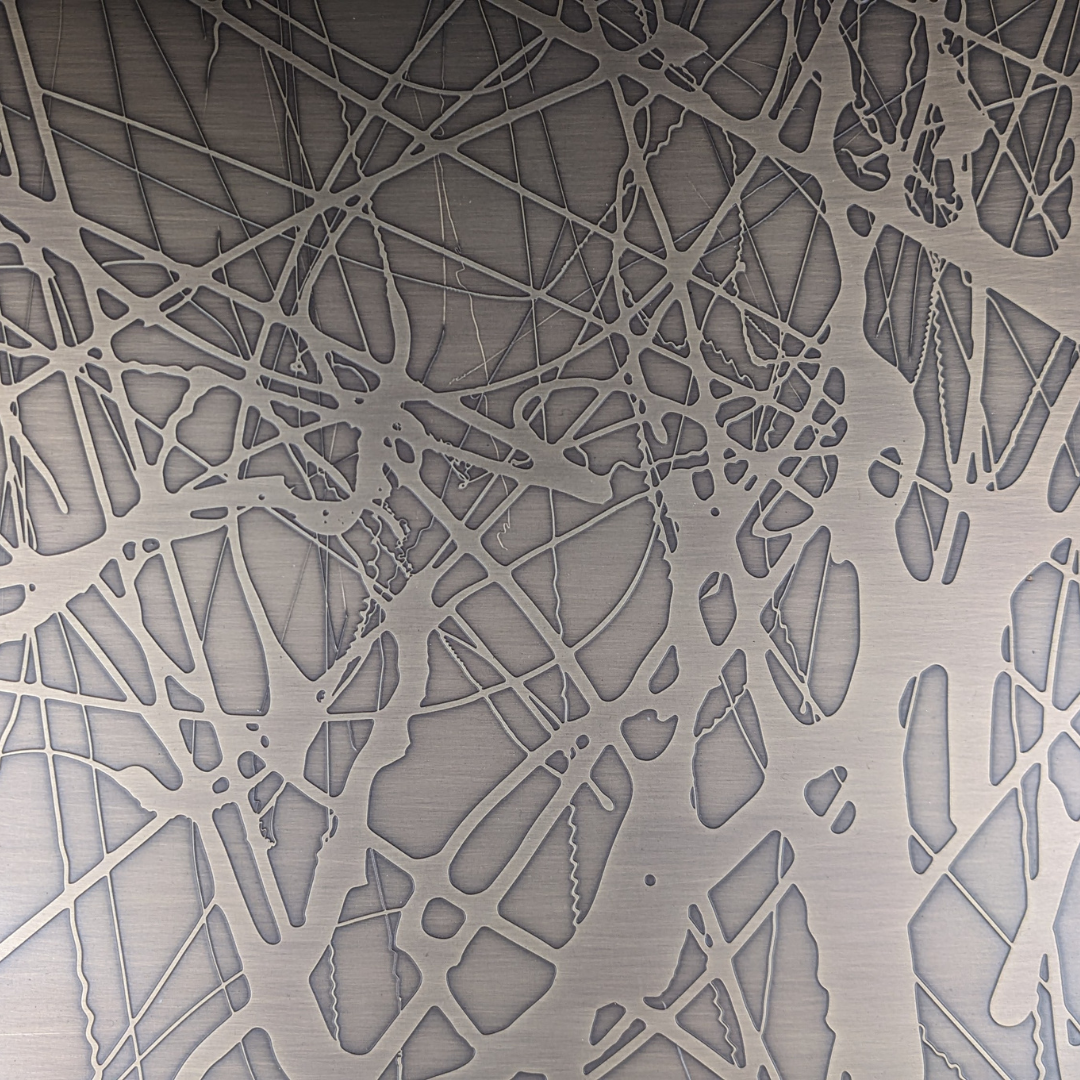 Organic etched pattern in brushed stainless